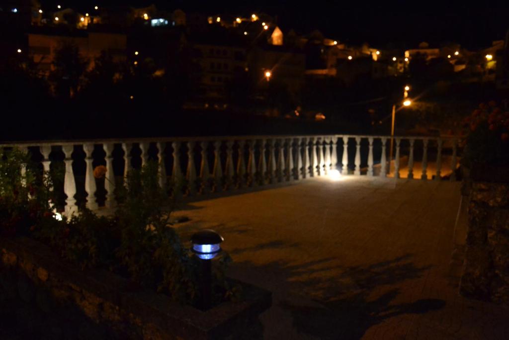a night view of a bridge with a light at Casa da Ponte do Arrocho in Loriga