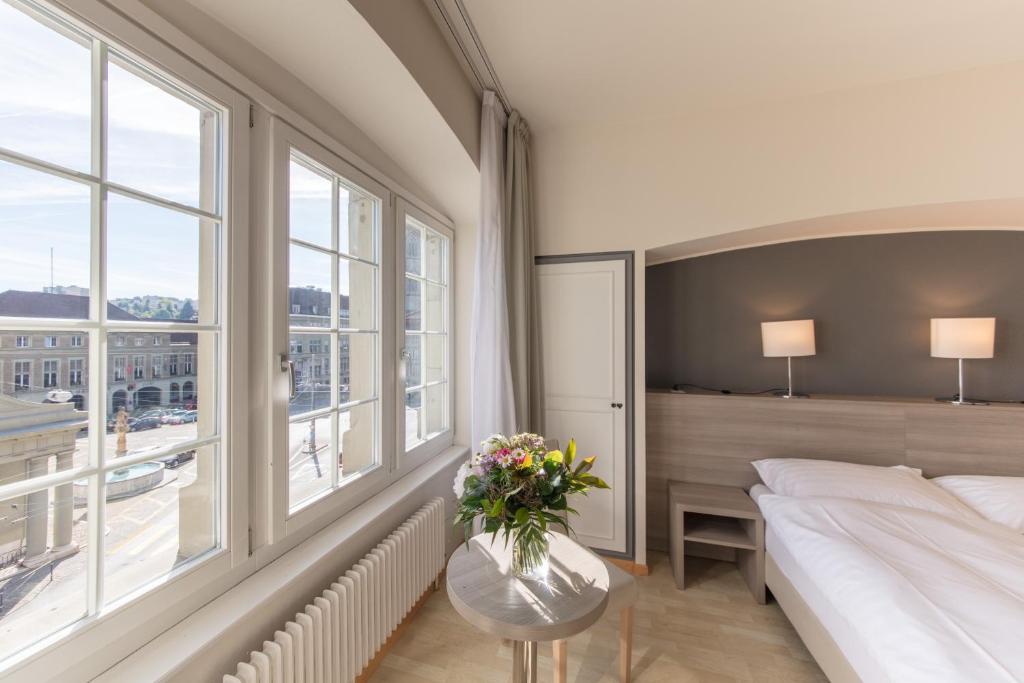 Voodi või voodid majutusasutuse Hôtel de la Rose toas