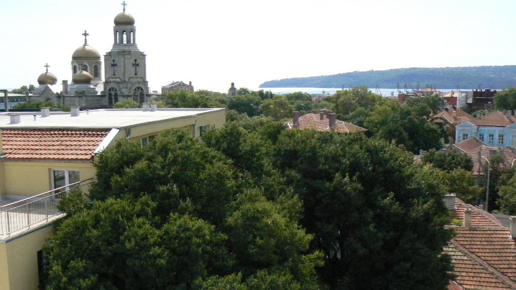 a view of a city with a church and trees at Yanov's Homestay in Varna City