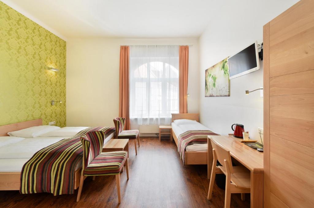 Uma cama ou camas num quarto em Hotel Mocca