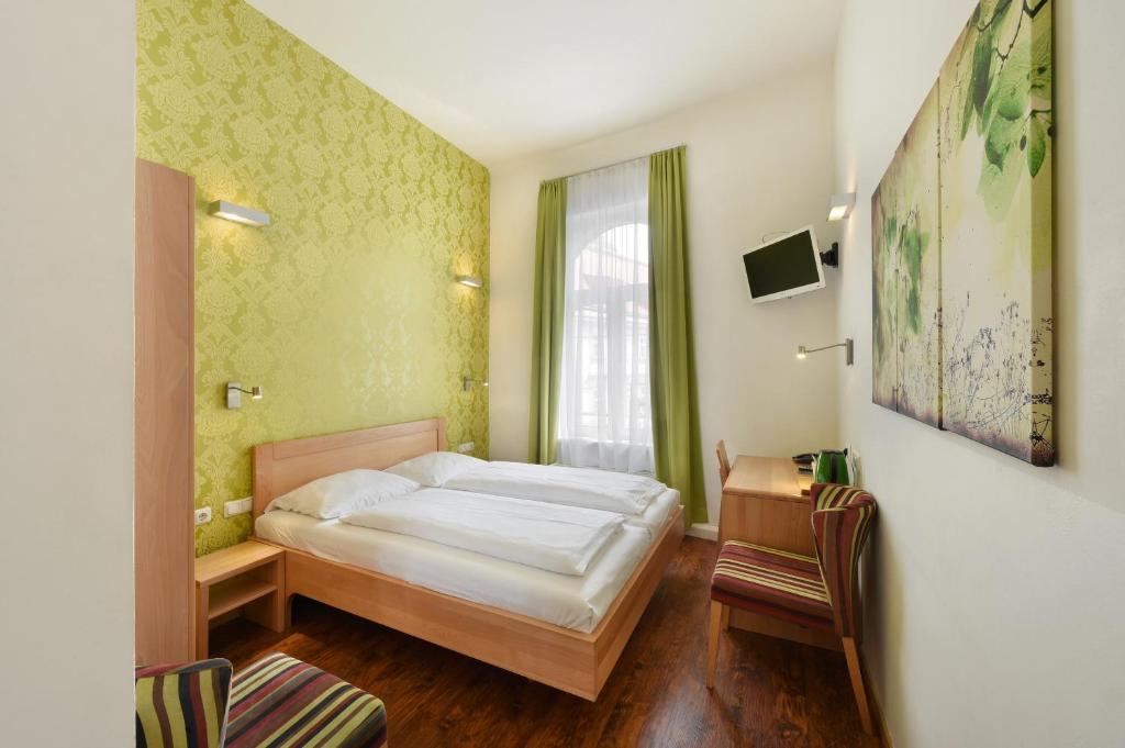 Uma cama ou camas num quarto em Hotel Mocca