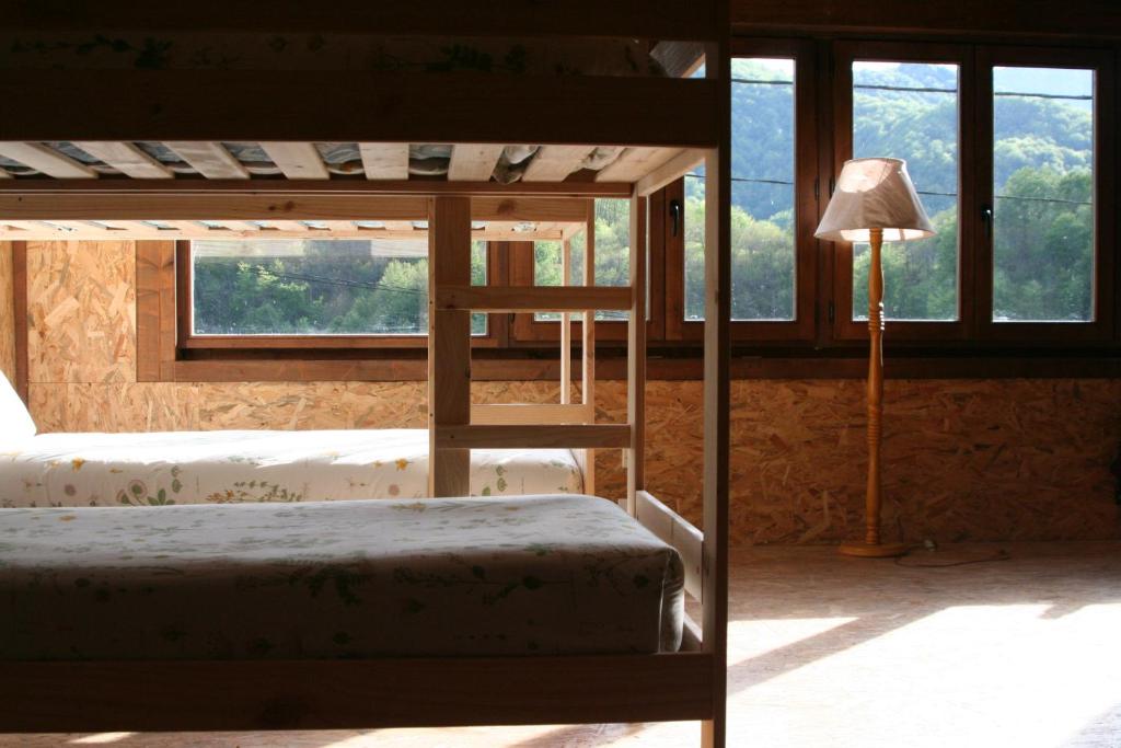 Postel nebo postele na pokoji v ubytování Albergue Les Xendes. Parque de Redes