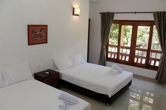 Postel nebo postele na pokoji v ubytování Finca Hotel Guali Santafe
