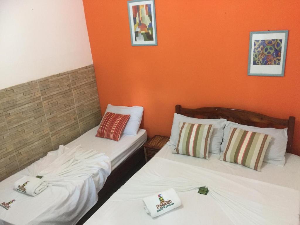 Voodi või voodid majutusasutuse Papagaio Hostel & Pousada toas