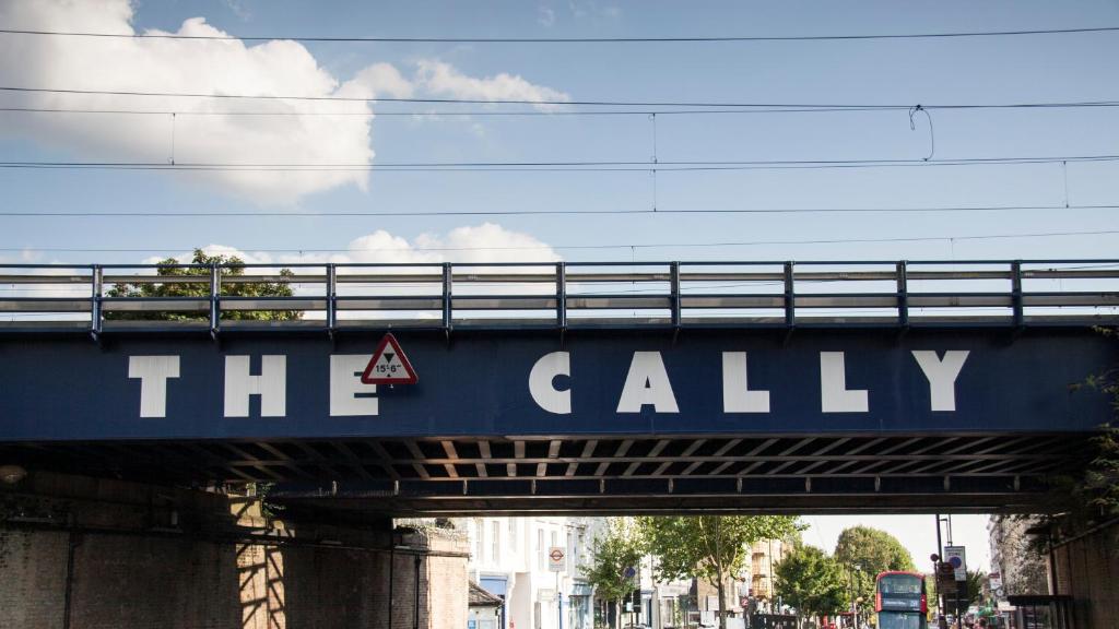 a blue sign that says the callery on a bridge at Caledonian Studio Flats in London