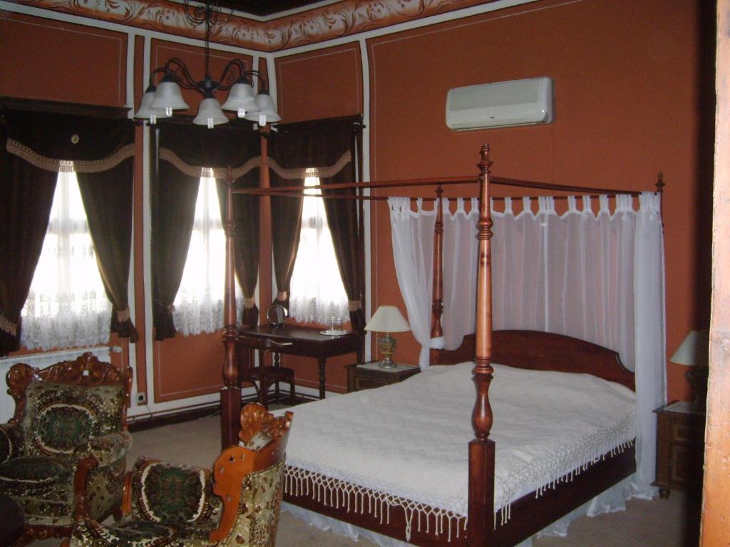 
A bed or beds in a room at Guest House Konsulato
