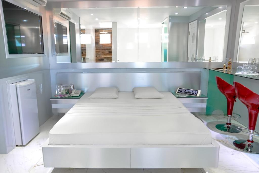 Postel nebo postele na pokoji v ubytování MOTEL LIBIDUS - Foz do Iguaçu