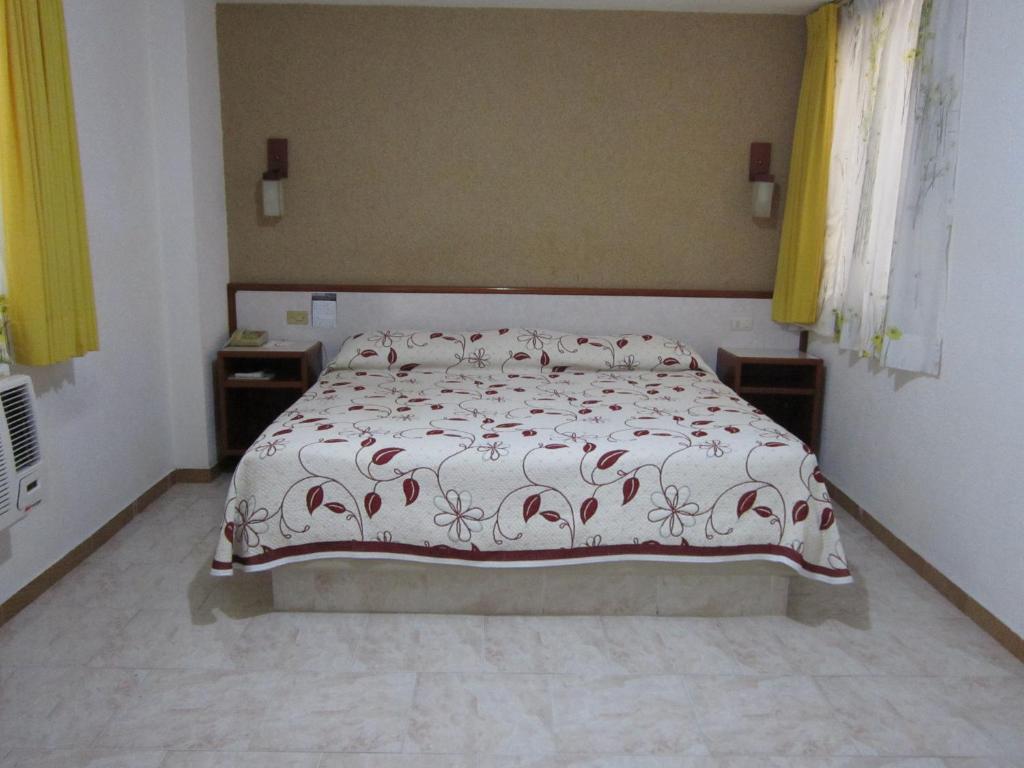 Postel nebo postele na pokoji v ubytování Hotel Baluarte