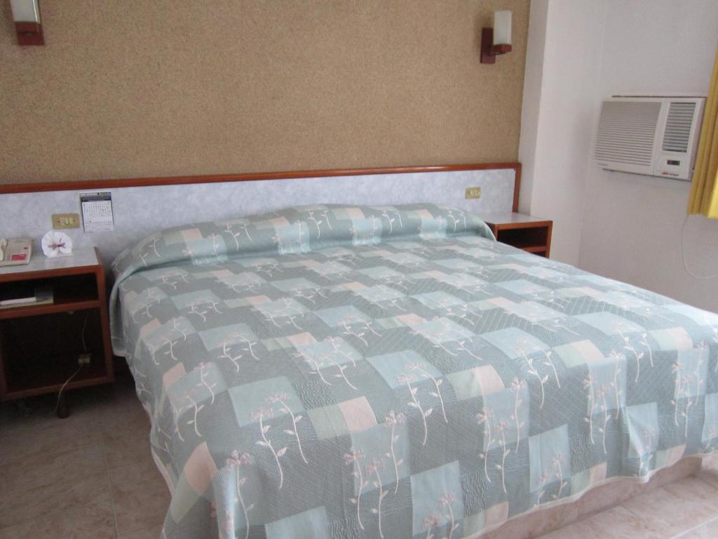 Postel nebo postele na pokoji v ubytování Hotel Baluarte