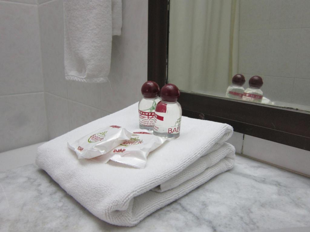 Postel nebo postele na pokoji v ubytování Hotel Baluarte