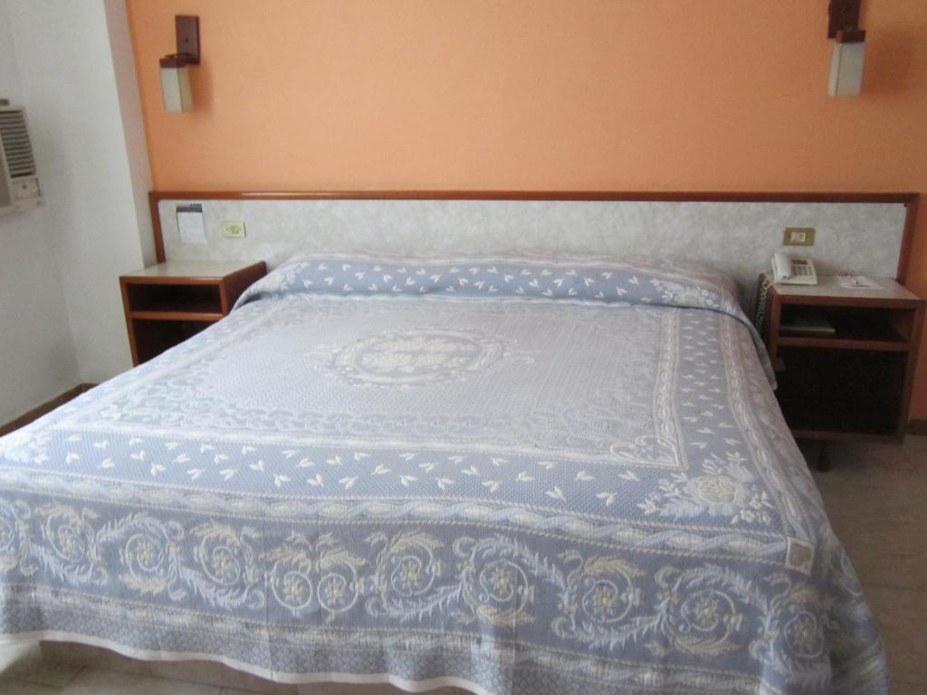 Postel nebo postele na pokoji v ubytování Hotel Baluarte