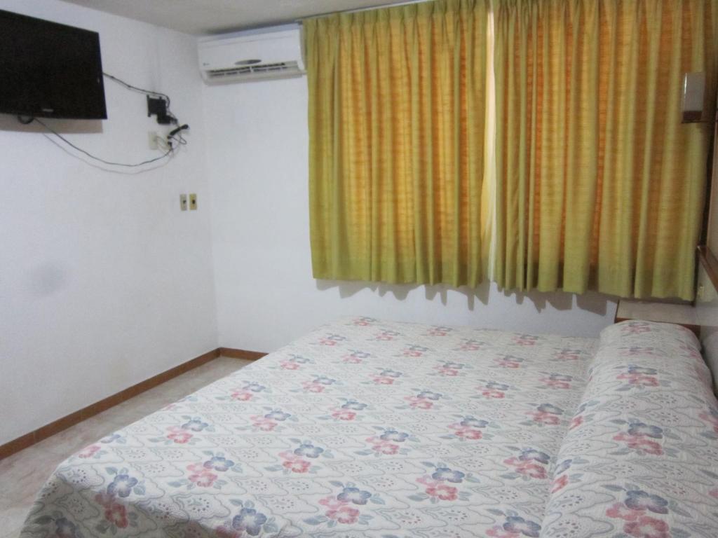 Postel nebo postele na pokoji v ubytování Hotel Baluarte