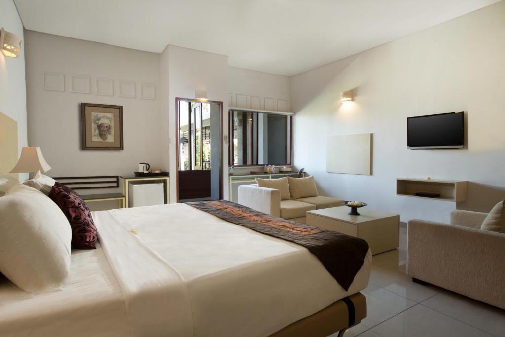 TV a/nebo společenská místnost v ubytování Alindra Villas & Spa