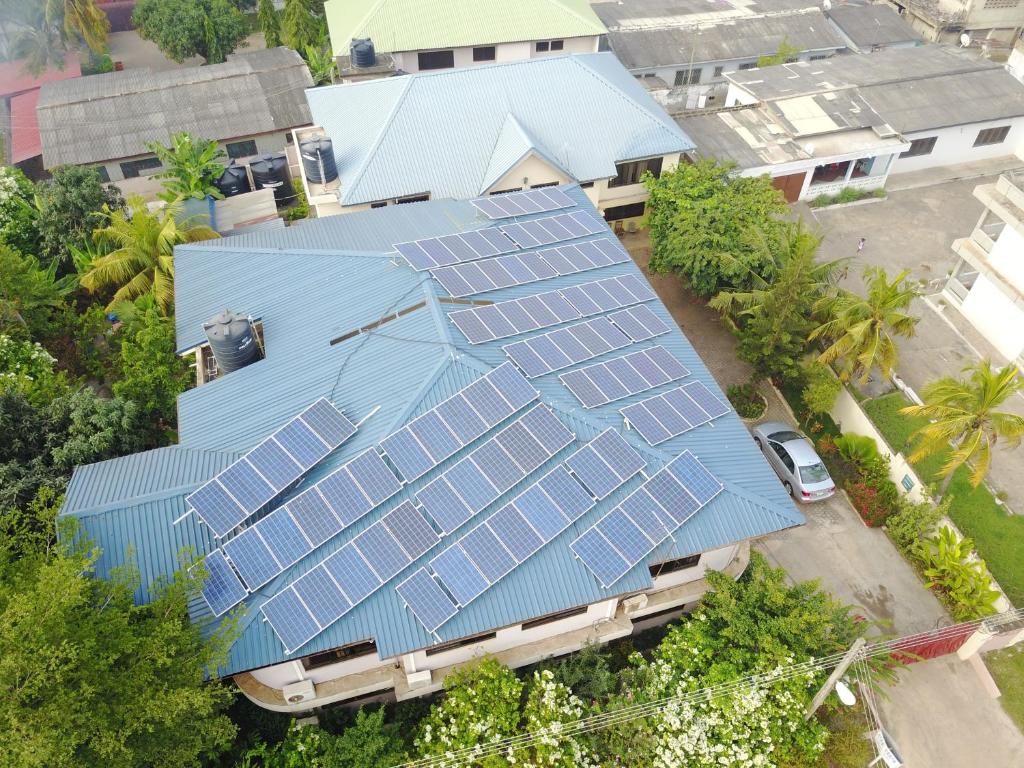 an overhead view of a house with solar panels on it at Osdahouse Lodge in Laterbiokorshie