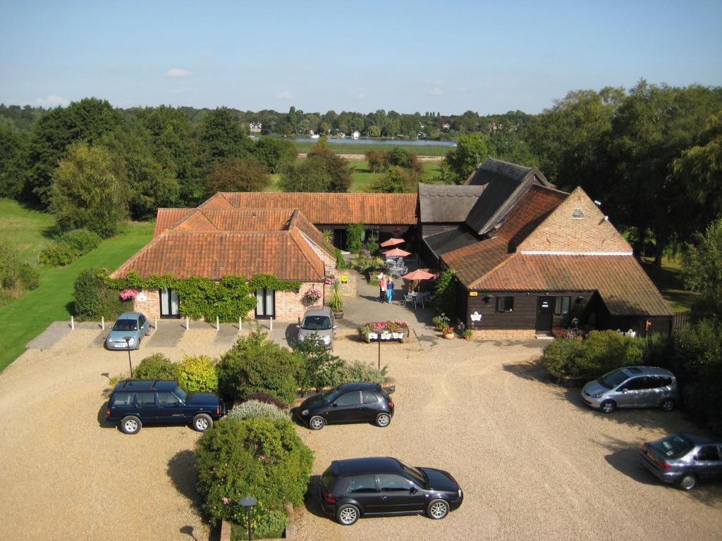 an aerial view of a house with cars parked in a parking lot at Ivy House Country Hotel in Lowestoft