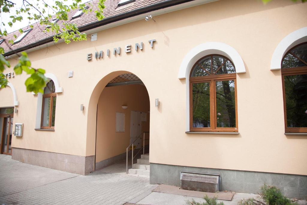 a building with the entrance to a building at Hotel Eminent in Zlaté Moravce