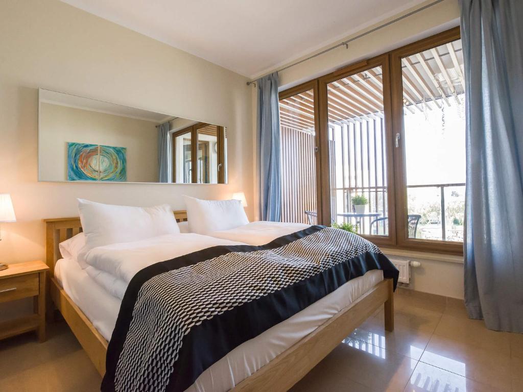 Posteľ alebo postele v izbe v ubytovaní VacationClub - Olympic Park Apartment 404