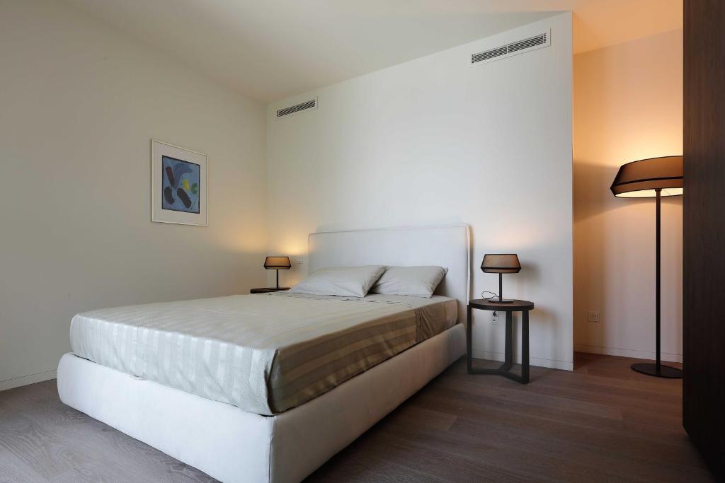 Postel nebo postele na pokoji v ubytování Laglio Como Lake Resort