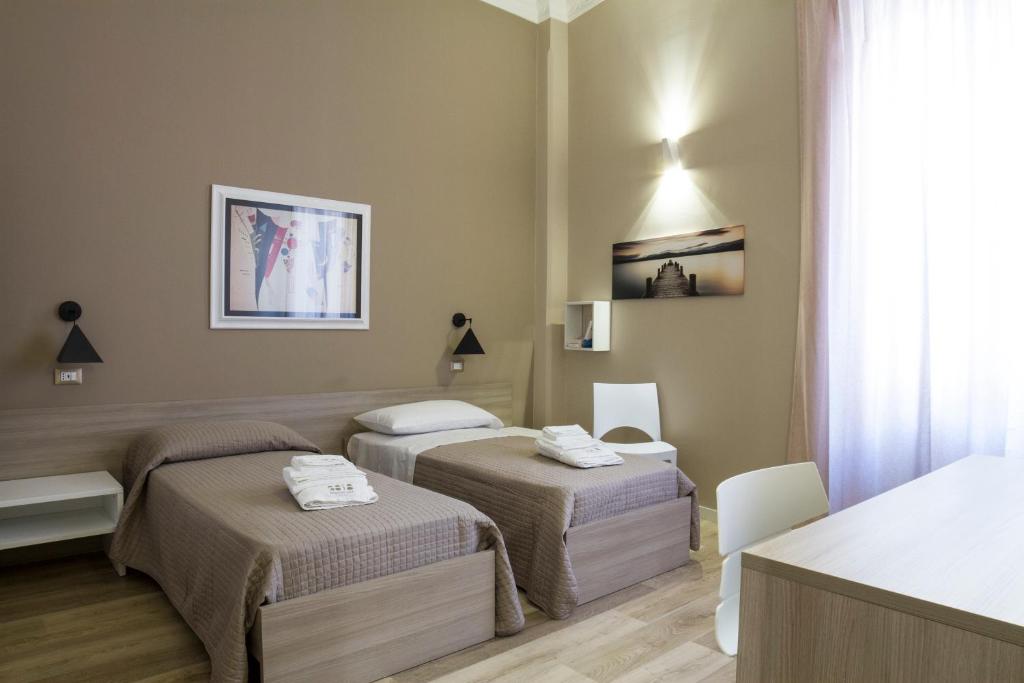 Łóżko lub łóżka w pokoju w obiekcie Bagnasco 18 suite&terrace
