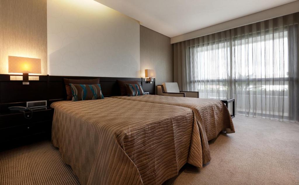 Postel nebo postele na pokoji v ubytování Cardal Hotel
