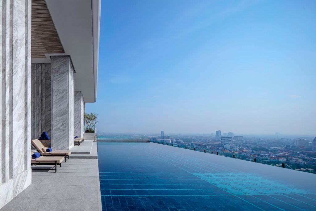 a swimming pool on the roof of a building with a view at 137 Pillars Residences Bangkok in Bangkok
