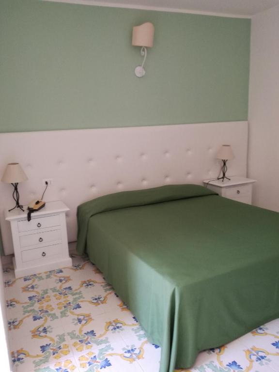 Postel nebo postele na pokoji v ubytování Hotel Residence Villa San Giovanni