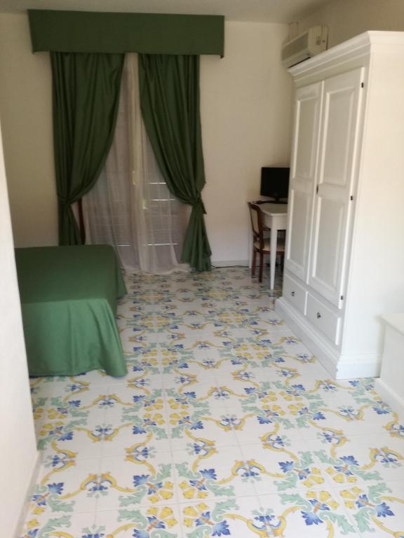 Postel nebo postele na pokoji v ubytování Hotel Residence Villa San Giovanni