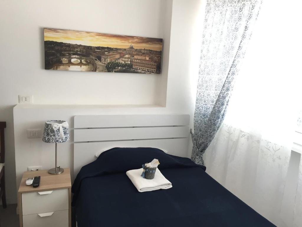 A bed or beds in a room at Aquarius Rome
