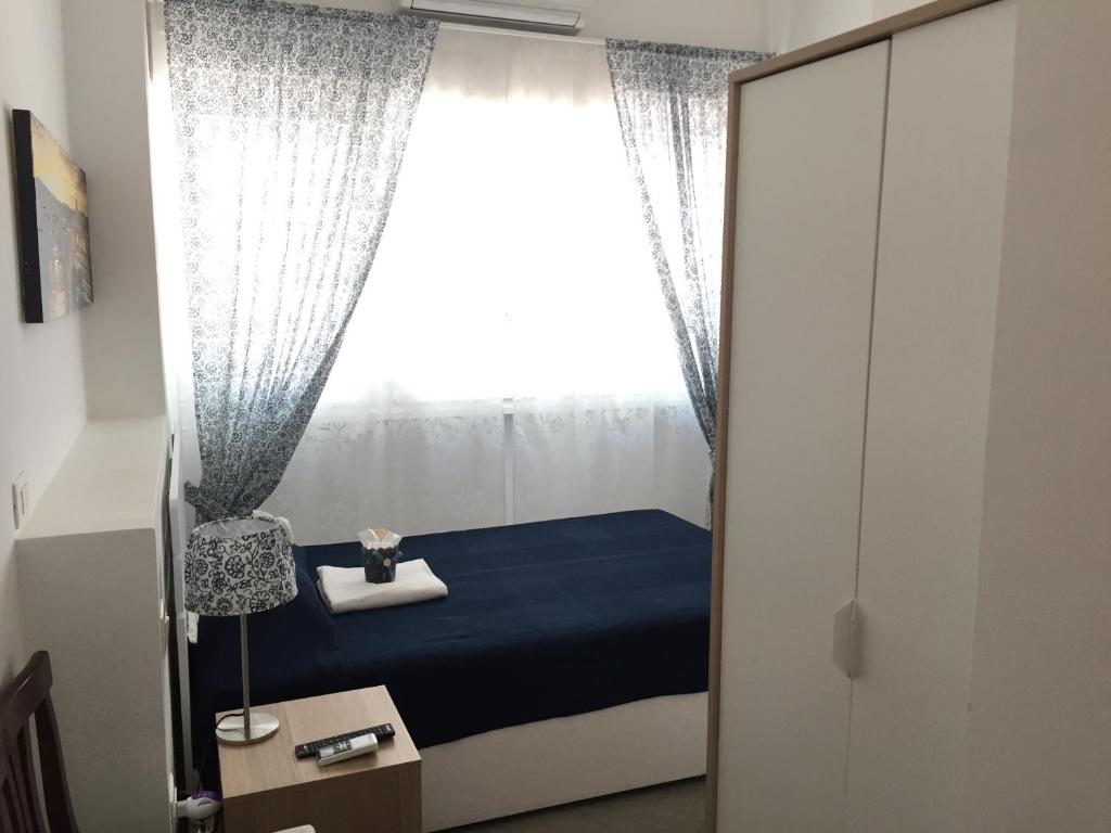 A bed or beds in a room at Aquarius Rome