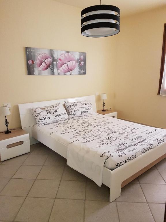 Postel nebo postele na pokoji v ubytování Appartamenti Via La Marmora