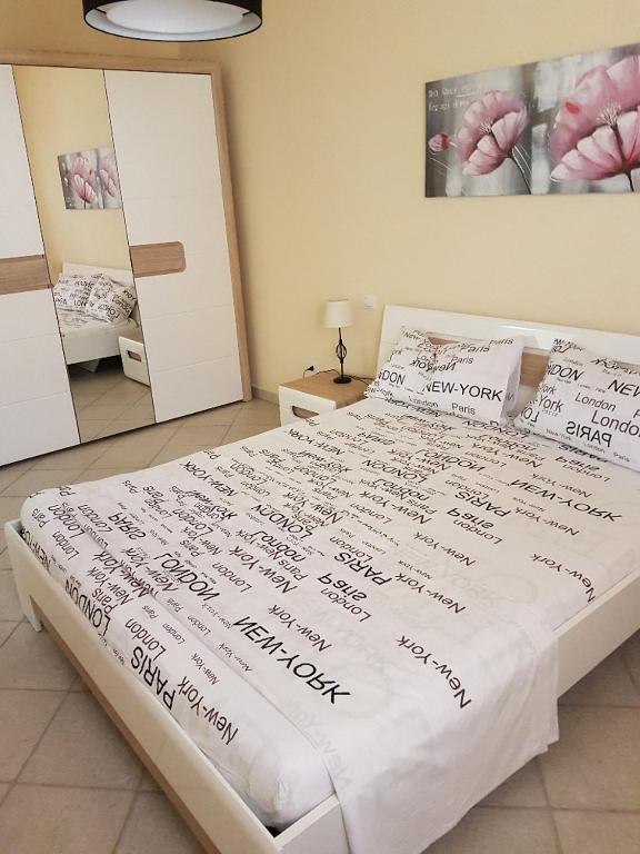 Postel nebo postele na pokoji v ubytování Appartamenti Via La Marmora