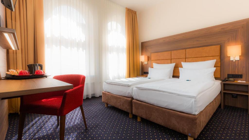 Cama o camas de una habitación en Hotel Fürst Bismarck