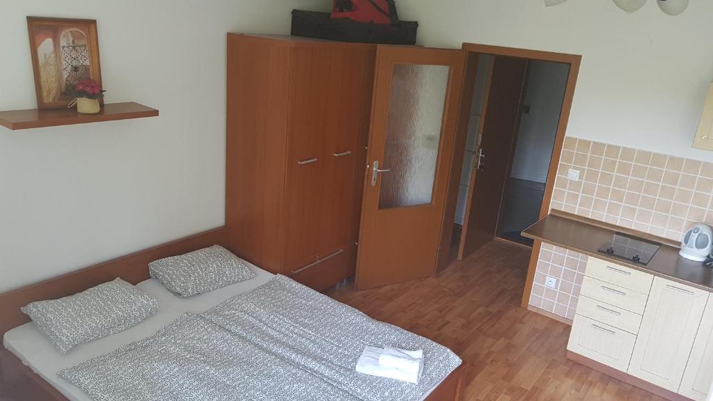 Postel nebo postele na pokoji v ubytování Golem Tatranská Štrba