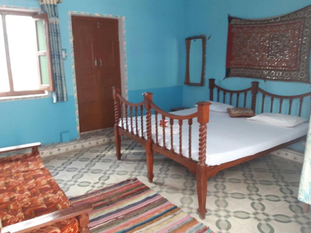 Postel nebo postele na pokoji v ubytování Hotel Paramount Palace