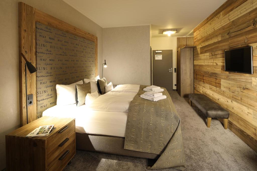 Postel nebo postele na pokoji v ubytování Nägler´s Fine Lounge Hotel
