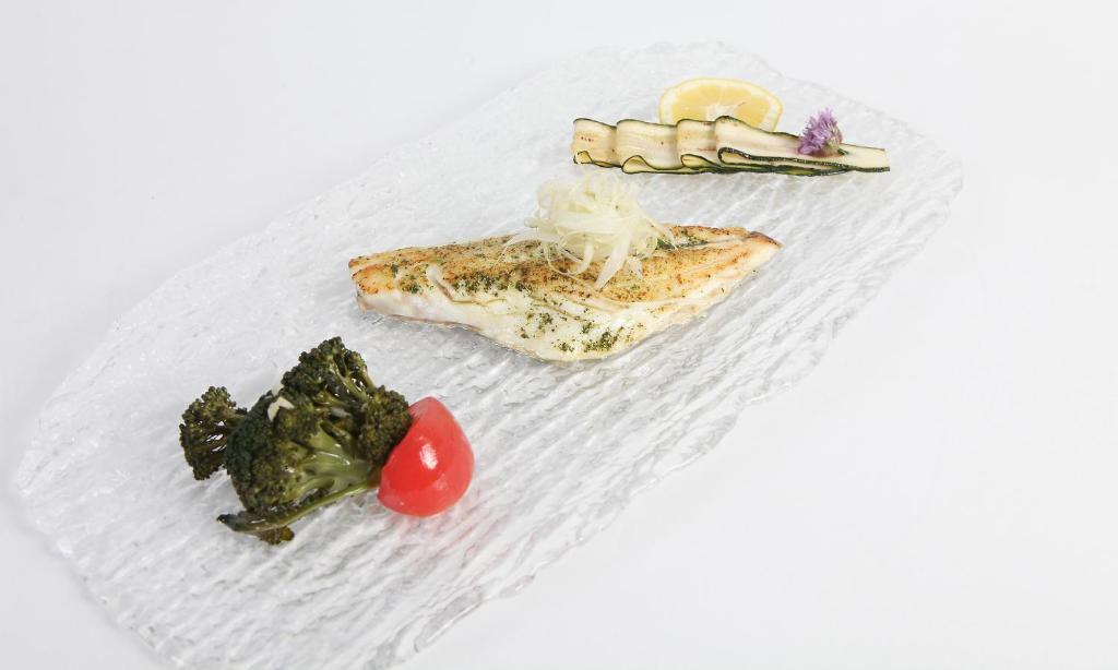 a plate of food with broccoli and vegetables on it at Hotel Capizzo in Ischia