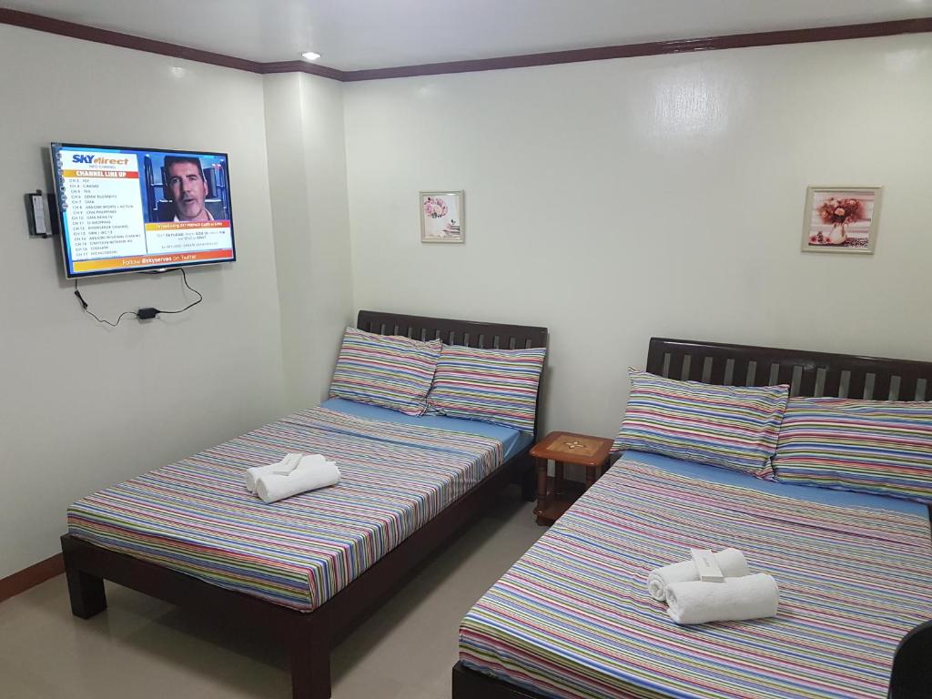 Postel nebo postele na pokoji v ubytování Hotel Georgina