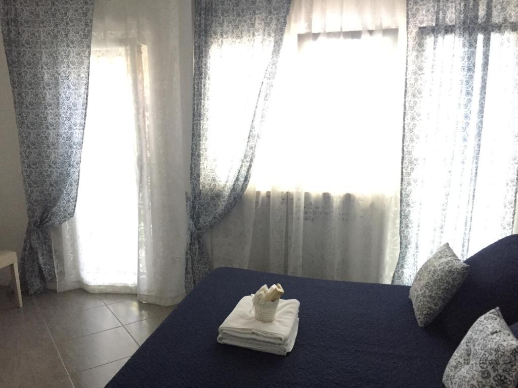 A bed or beds in a room at Aquarius Rome