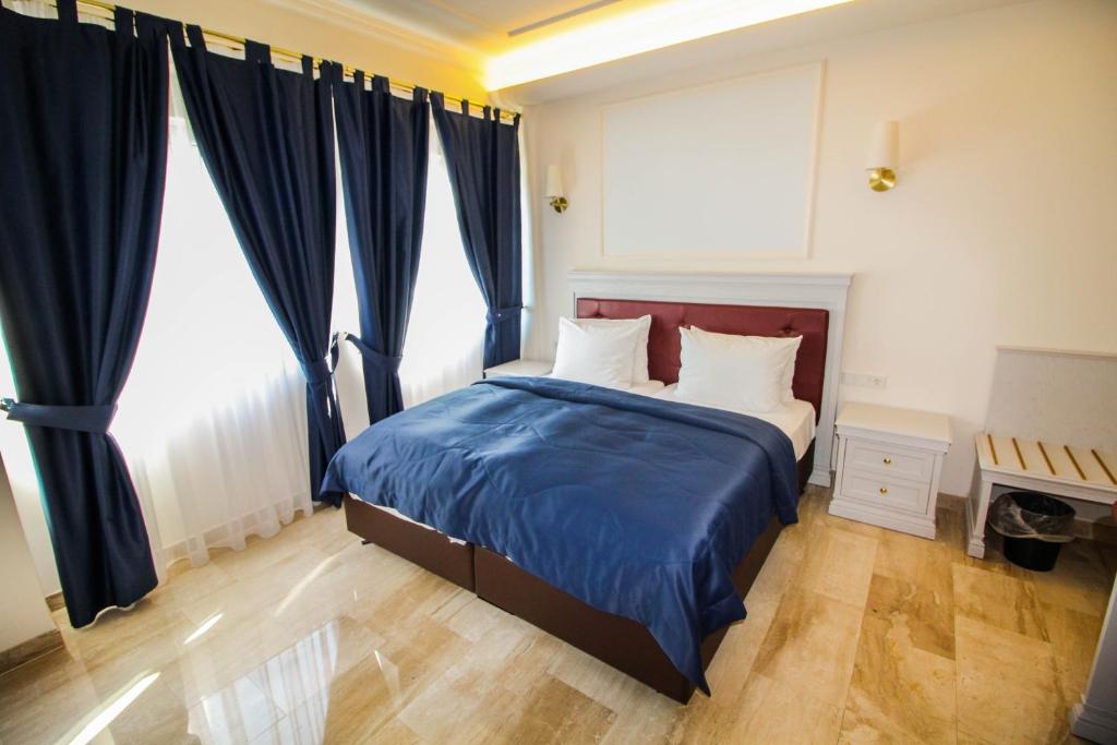 Postel nebo postele na pokoji v ubytování Grand Hotel Palladium