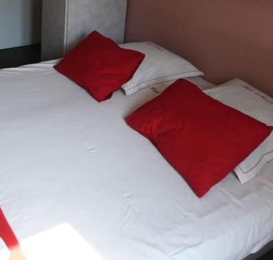 Postel nebo postele na pokoji v ubytování Hotel Anvers