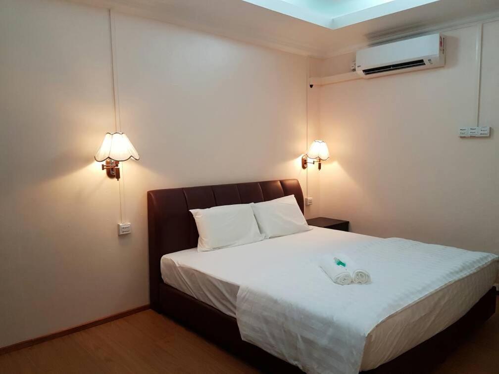 Postel nebo postele na pokoji v ubytování Perhentian Island Cocohut Long Beach Resort
