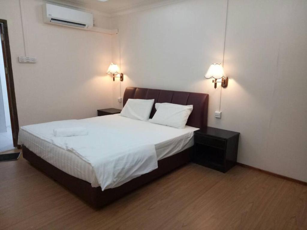 Postel nebo postele na pokoji v ubytování Perhentian Island Cocohut Long Beach Resort