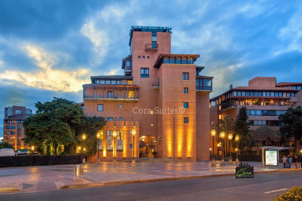 a large building with lights in front of it at Cora 127 Plenitud in Bogotá