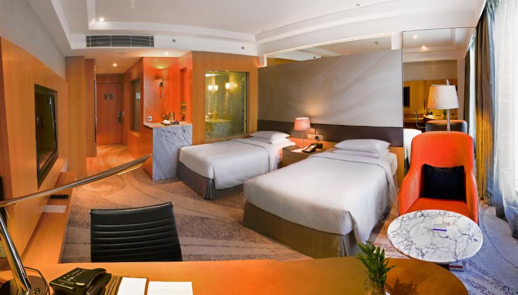 Postel nebo postele na pokoji v ubytování Hyatt Regency Gurgaon