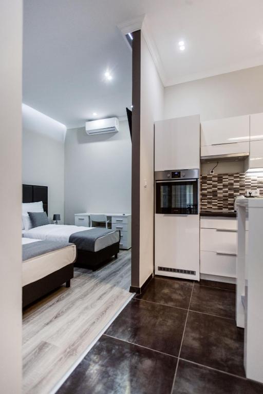 Postel nebo postele na pokoji v ubytování A Golden Star Modern Luxury Apartments and Rooms Budapest