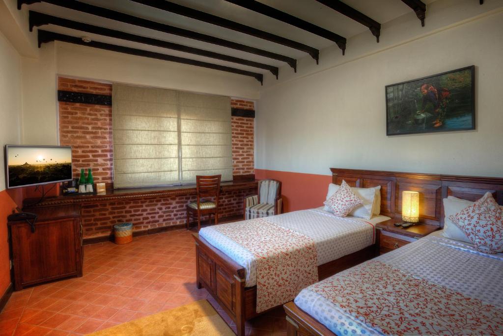 Postel nebo postele na pokoji v ubytování Traditional Comfort Boutique Hotel