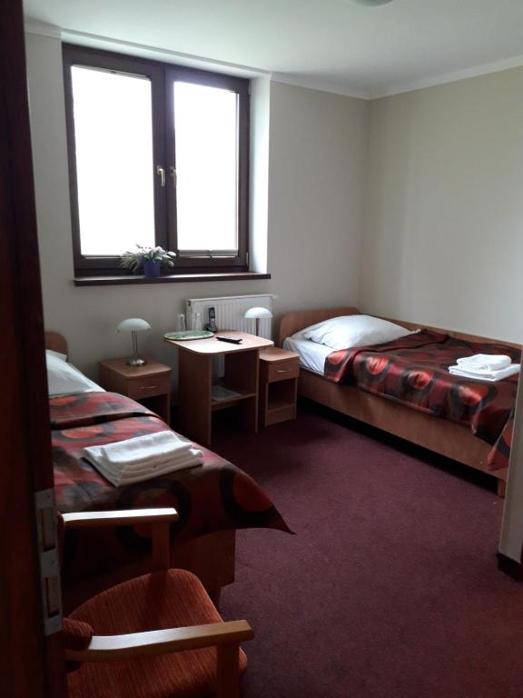 Posteľ alebo postele v izbe v ubytovaní Hotel Paola