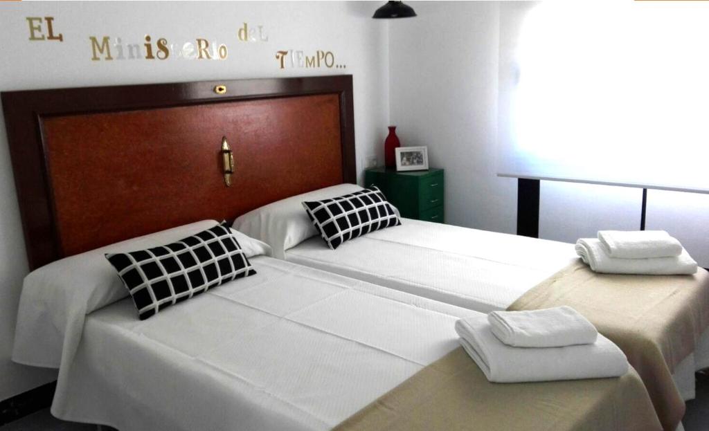 A bed or beds in a room at Ohana Apartamento Rural