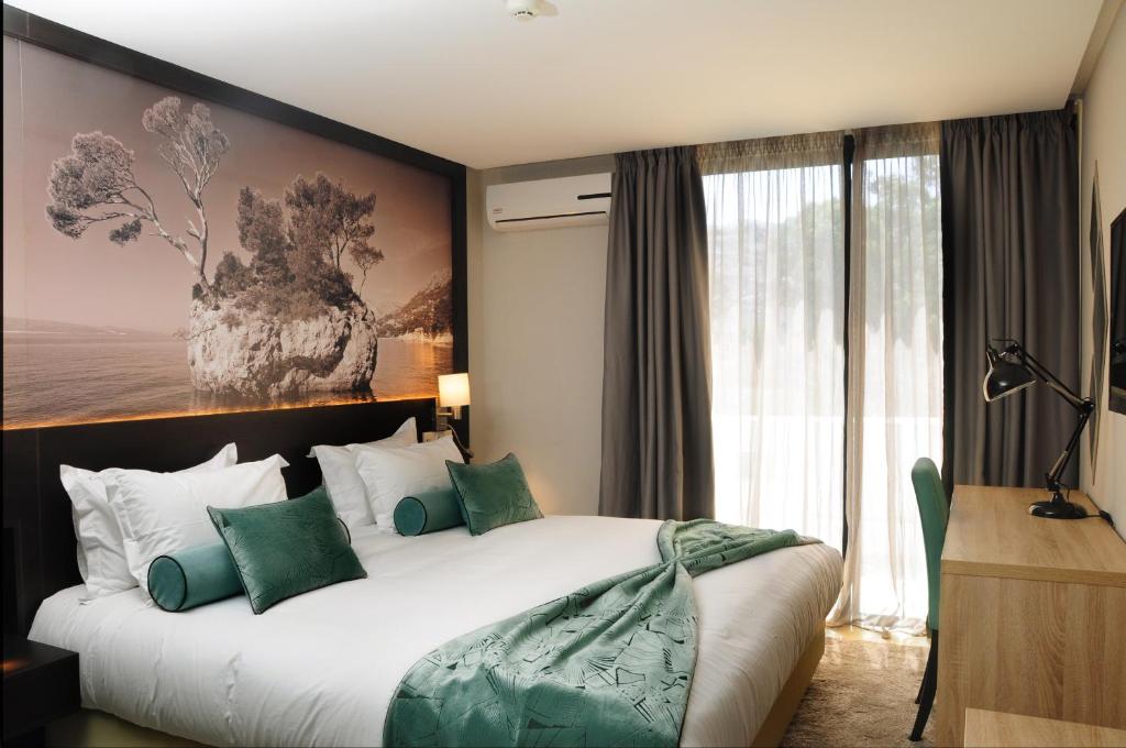 Postel nebo postele na pokoji v ubytování Appart'hotel Souani (Al Hoceima Bay)