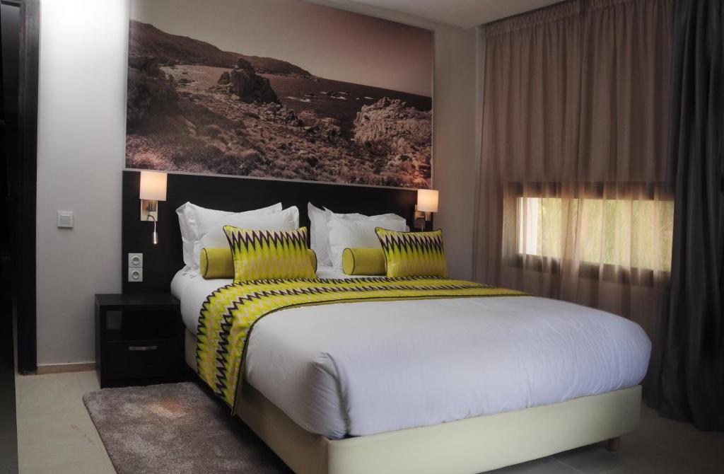 Postel nebo postele na pokoji v ubytování Appart'hotel Souani (Al Hoceima Bay)